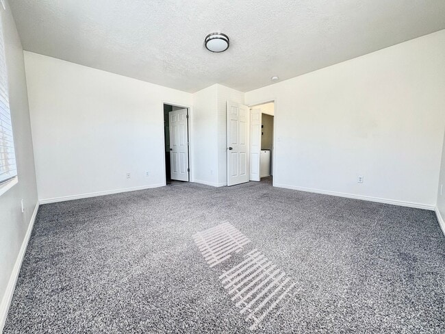 Building Photo - Spacious 3 Bed Townhome in West Valley City with Gated Yard, Garage & Pool