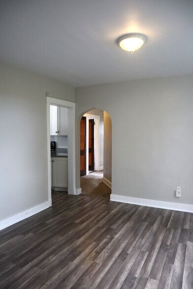 Formal dining room with archway and space for full dining set. - 201 Richbarn Rd