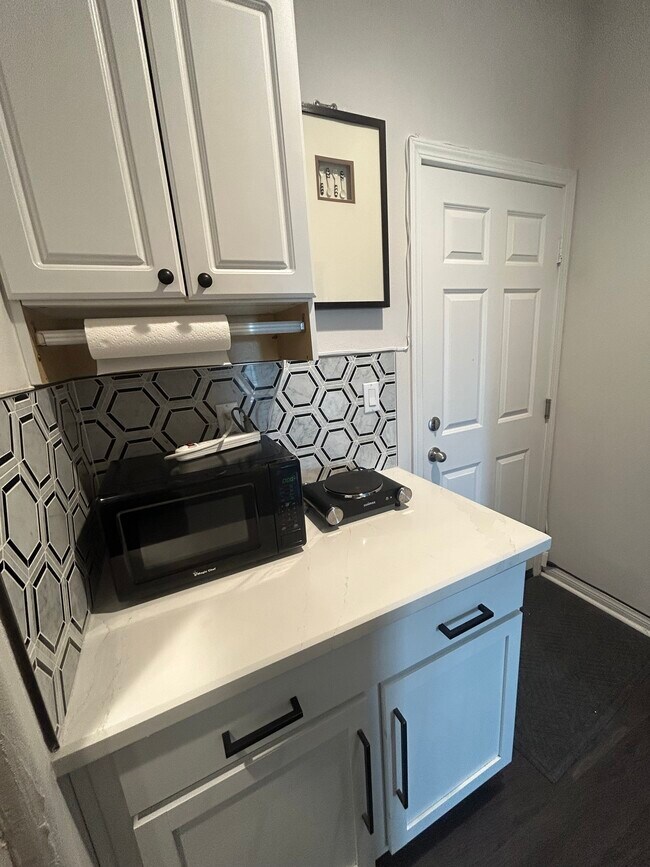 Small kitchen comes with microwave, cooktop, oven not in picture and top and bottom cabinets. - 24734 Silver Stone Ct
