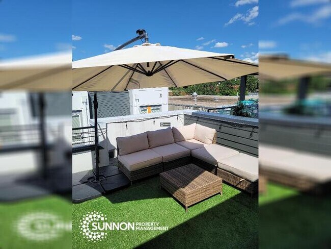 Building Photo - Modern 2 BR 2.5 BA Townhome with Rooftop D...
