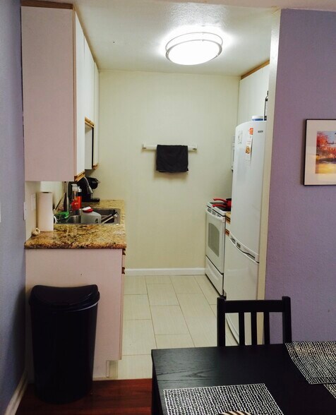 Marvel countertops in the kitchen sit on all new White appliances including a dishwasher - 970 Palm Avenue