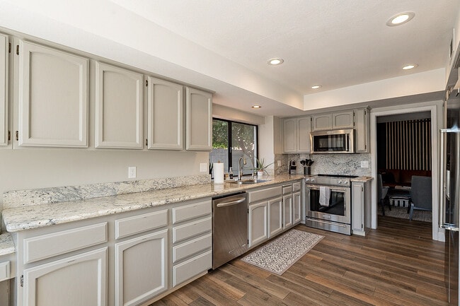 Kitchen with long counters and plenty of prep space - 15849 N 61st St