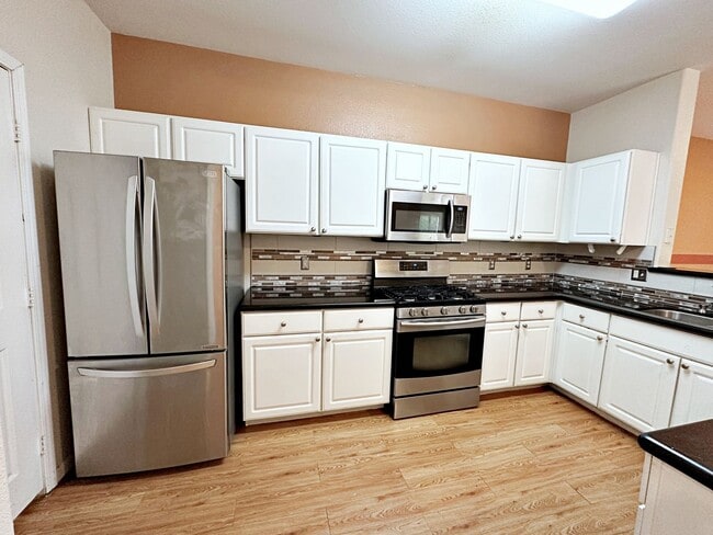 Building Photo - 3 BEDROOM CONDO IN  GUARD GATED COMMUNITY