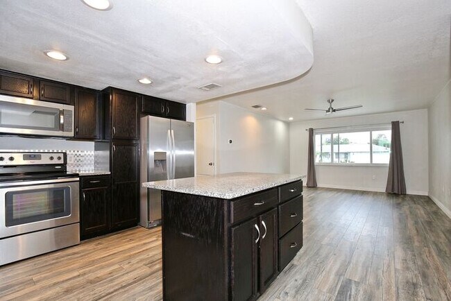 Building Photo - Gorgeous 4/2 Pool Home with a Covered Patio and a Large Fenced Backyard Located in Dr. Phillip's ...