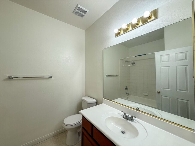 Building Photo - SPACIOUS HOME IN GATED COMMUNITY WITH POOL, RV PARKING & 4-CAR GARAGE!