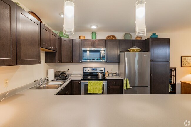 Building Photo - Spacious 1-Bedroom with Den & Premium Amenities at Village at Autumn Pond