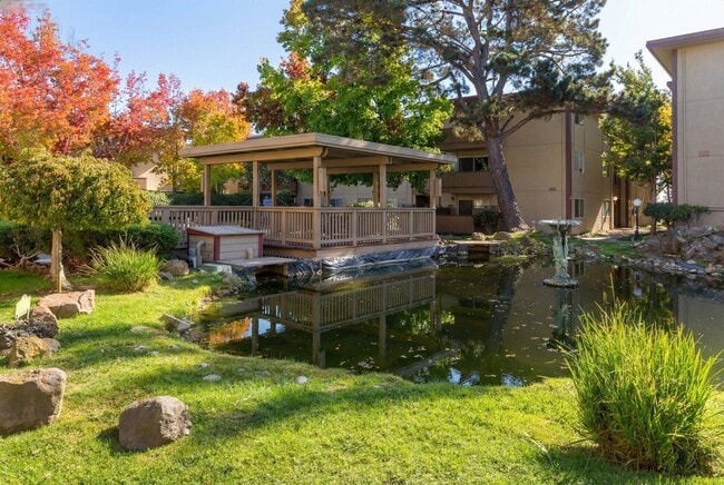 Building Photo - Modern 2-Bedroom Condo with Pool and Koi Pond Views