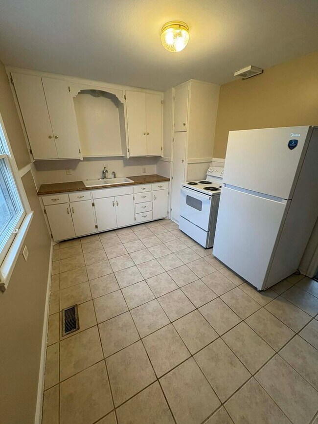 Building Photo - Welcome to Your Next Home with Harvest Investments!