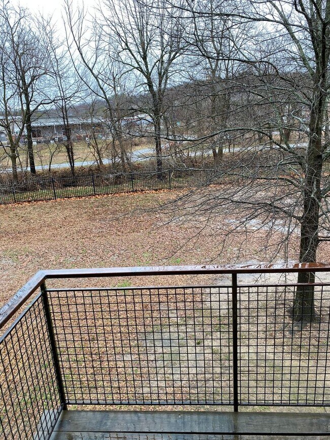 Building Photo - School Year Lease! 3 Bedrooms, 2.5 Bathrooms Townhouse near University of Arkansas - 1x Car Garag...