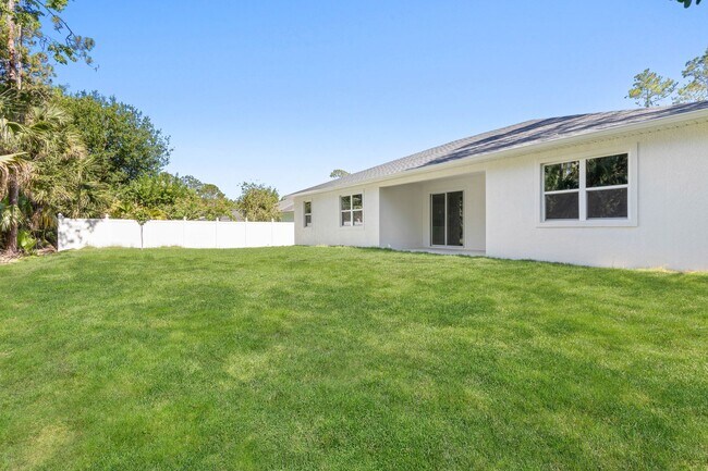Building Photo - Spacious 4-Bedroom Rental in Palm Coast with Ultimate Privacy