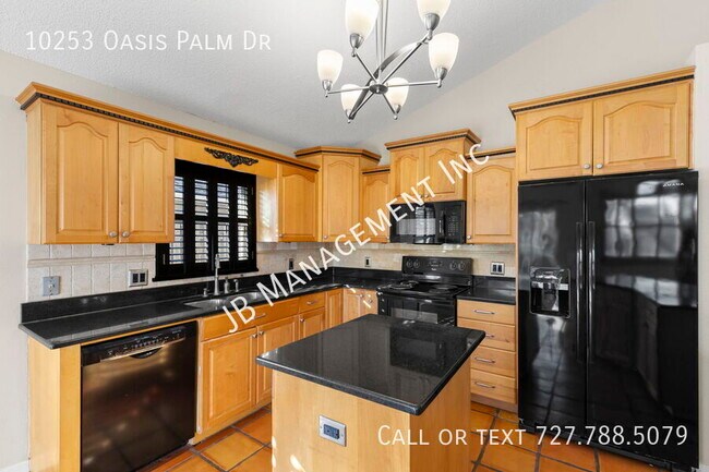 Building Photo - 10253 Oasis Palm Dr