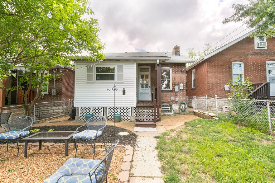 Fenced backyard with fire pit and detached garage - 4945 Delor Street