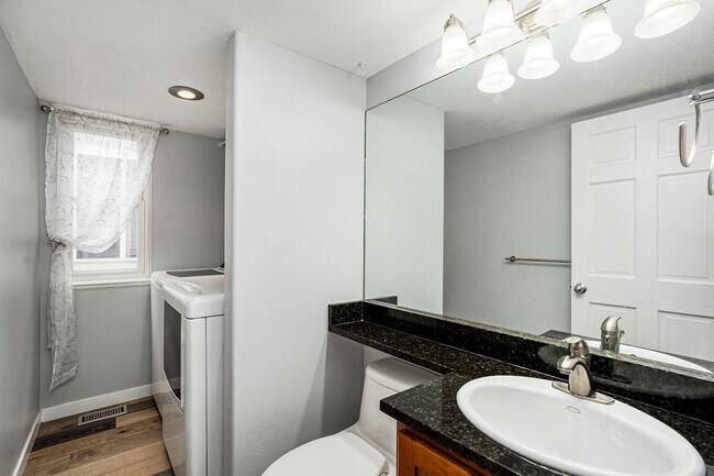 Building Photo - Spacious 4-Bedroom Home in District 20 with Huge Deck & Fenced Yard