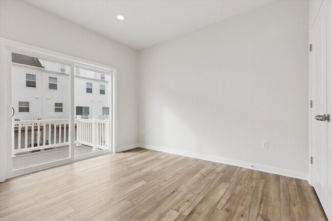 Building Photo - COMING SOON! Brand New River Pointe townhome with modern finishes, flexible living space, and a p...