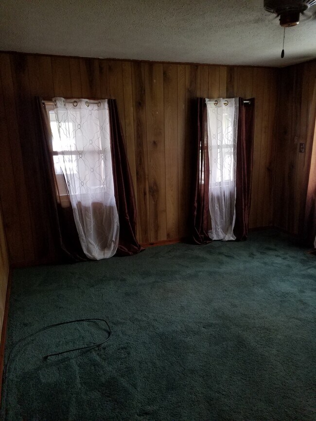 Livingroom, east wall. Windows open to Front Porch. - 15 Goodrich St