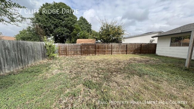 Building Photo - Three bedroom home with covered patio