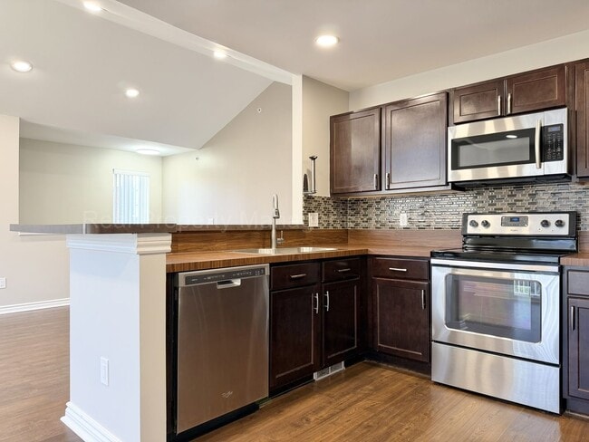 Building Photo - Rare Corner Upper Condo with Vaulted Ceilings, Private Balcony and 2 Car Garage - Right Across fr...