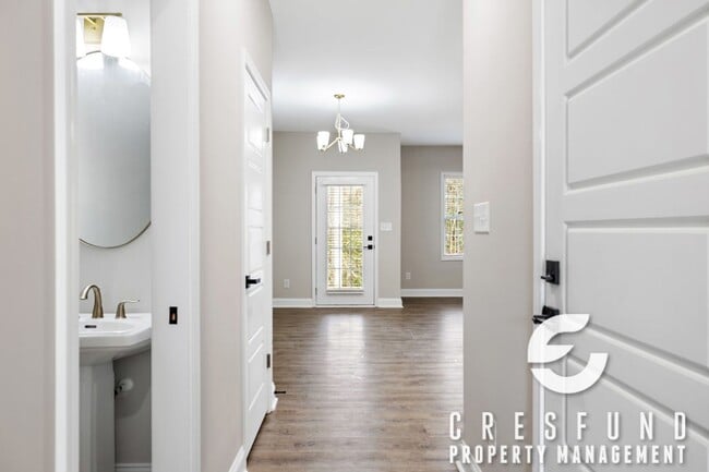 Building Photo - Don't miss out on these new construction Luxury Townhomes on the Lake! Call about our military Sp...