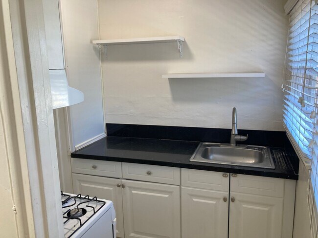 Building Photo - Spanish Garden Style Apartment Community