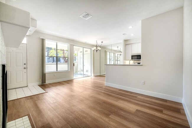 Building Photo - Coastal Living at Its Best – Upgraded 1BR Condo with Private Patio & Resort-Style Amenities