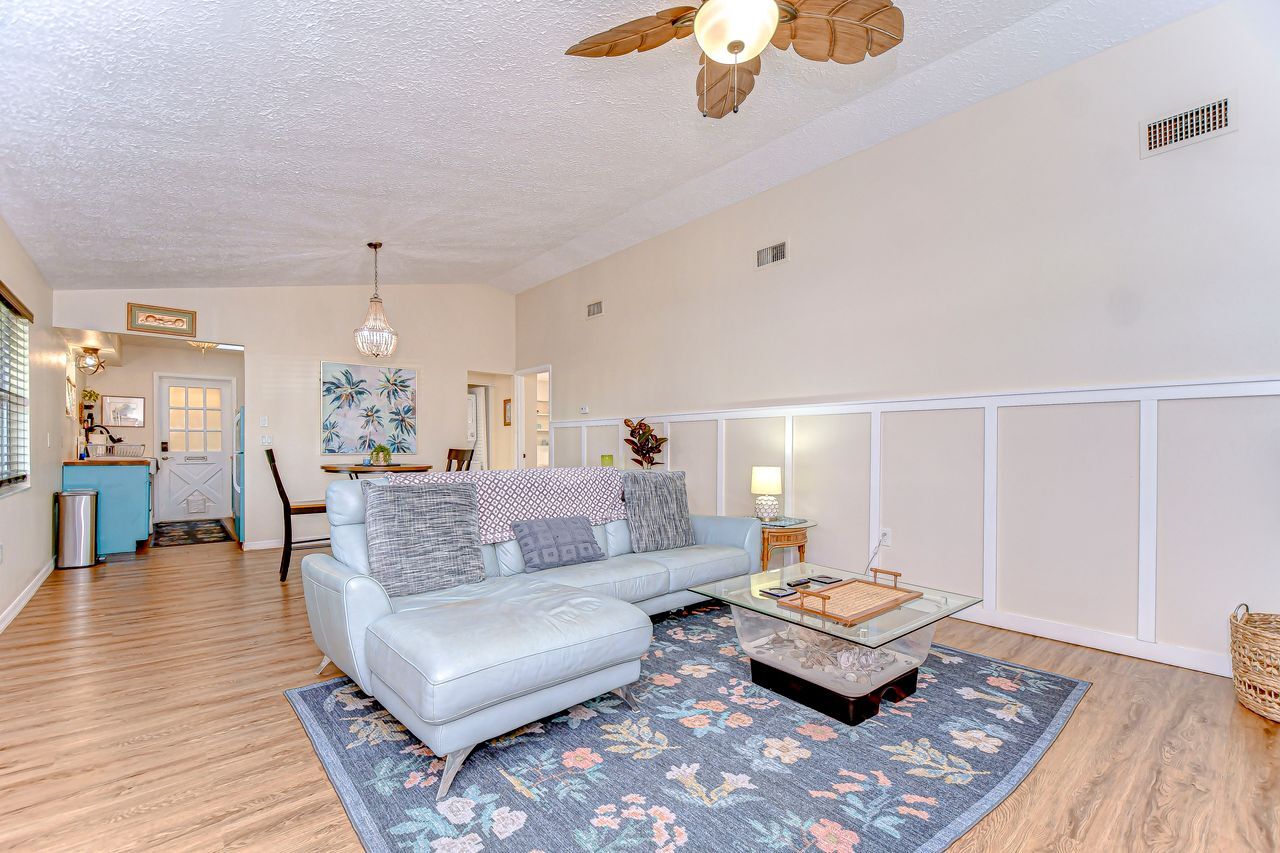 Living room features a 40" smart tv , vaulted ceilings and a dining space - 5114 33rd St E