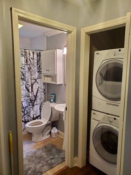Laundry closet with washer/dryer and view of bathroom - 806 Lupton Dr
