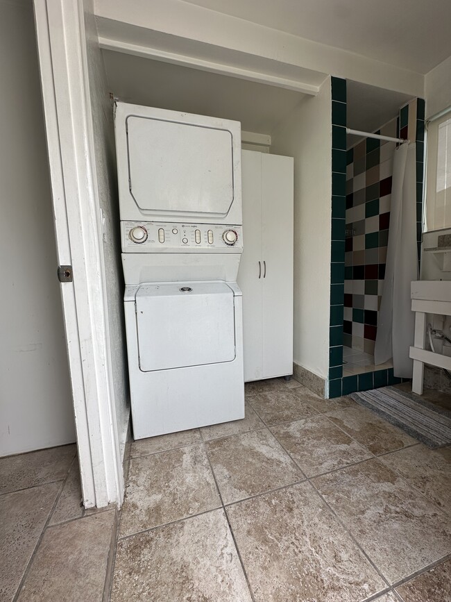 Laundry with complete bathroom. - 7403 Vanalden Ave