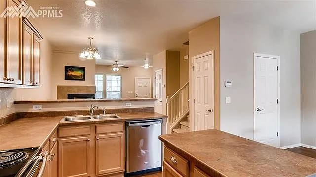 Kitchen with open view to living room - 3549 Bay Owl Grv