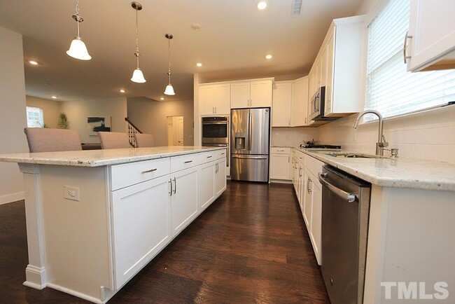 Building Photo - Main Floor Owner's Suite PLUS Main Floor G...