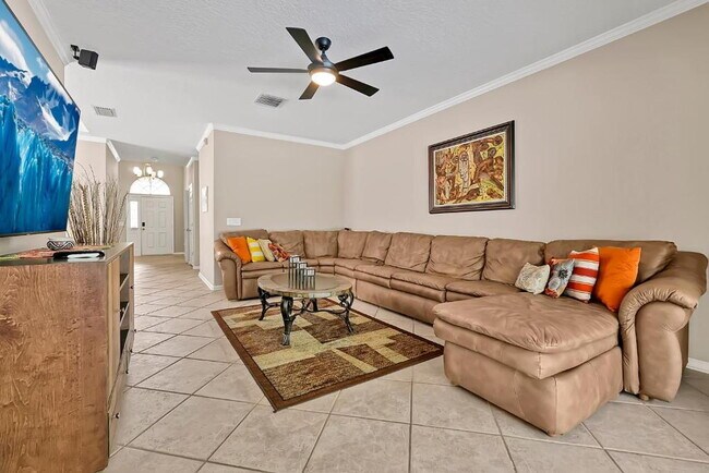 Building Photo - "Stunning Fully Furnished 3BR Orlando Home with Private Screened Pool, Spa & Spacious Living Areas"