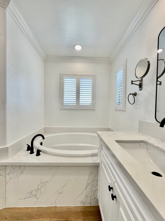 Building Photo - Beautifully Remodel Townhouse with AC & Two Car Garage!