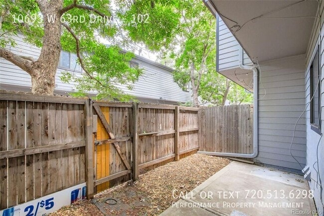 Building Photo - 10693 W 63rd Dr