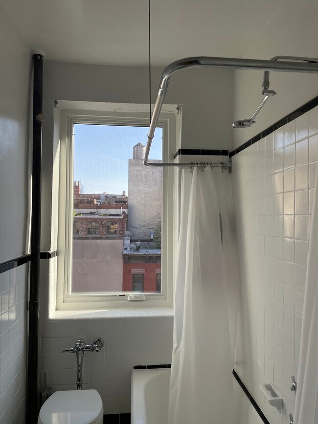 Updated bathroom window - 255 W 23rd St