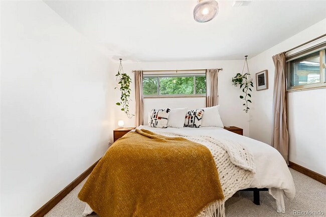 Large, quiet primary bedroom with attached full bathroom. - 516 Monaco Pky