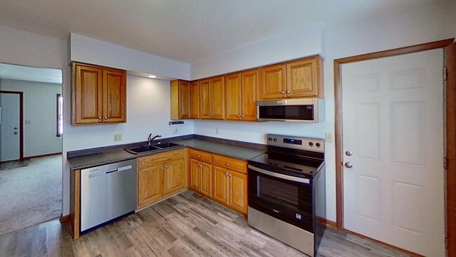 Building Photo - Updated two bedroom ranch duplex with partial basement finish, detached garage, close to mall/sho...