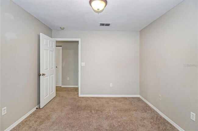 Building Photo - 9506 Lake Chase Island Way