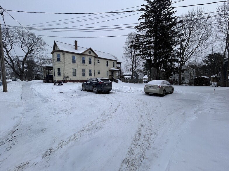 Building exterior and off-street parking - 23 E Kidder St