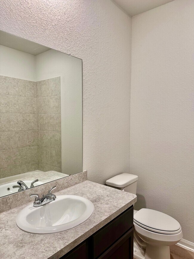 The secondary bathroom features plenty of counter space and a tub/shower combo! - 507 Turtle Dove Dr