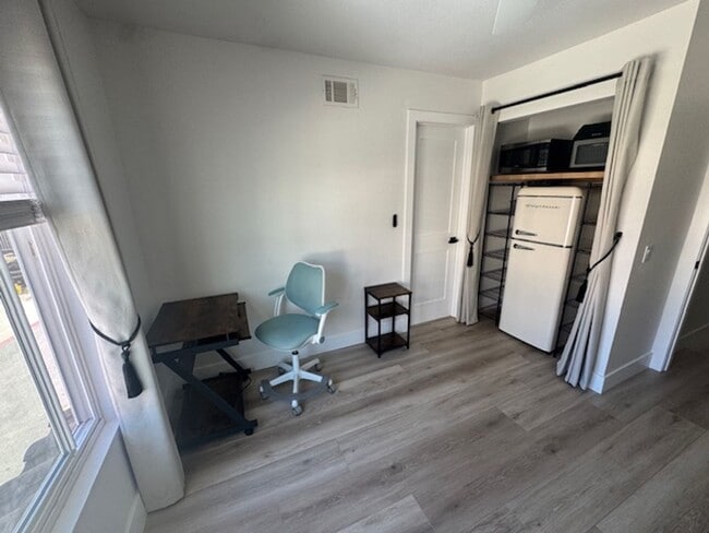 Building Photo - Furnished Bedroom rental with Bonus Kitchenette and office room