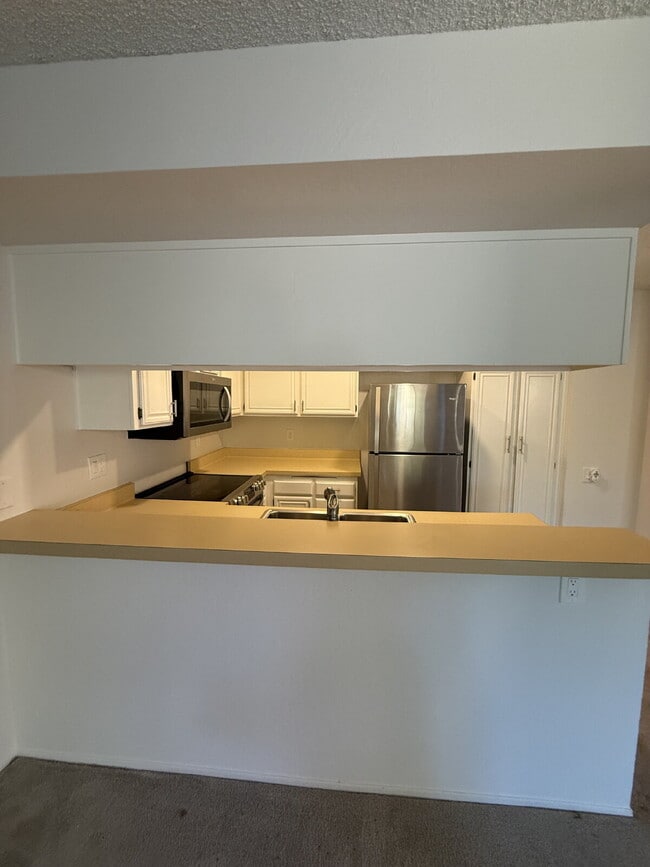 Building Photo - Spacious 3-Bedroom, 2-Bath Multi-Level Home with Balcony, In-Unit Laundry & Dual Parking
