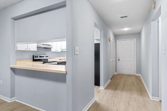 Building Photo - Freshly Updated 2BR Condo with Private Balcony, Community Pool, & In-Unit Laundry