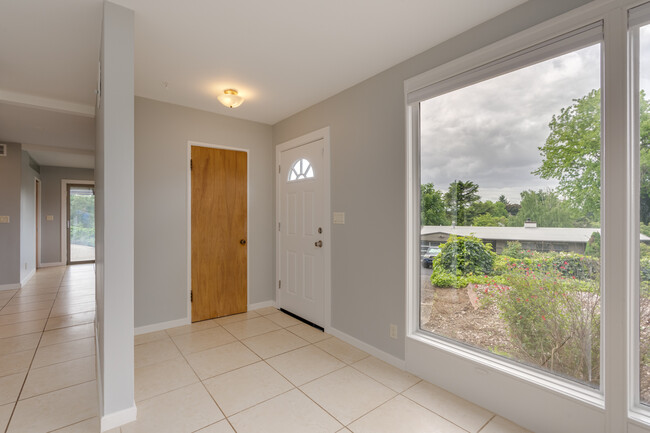 Front door and entry hall closet - 211 Farview Drive