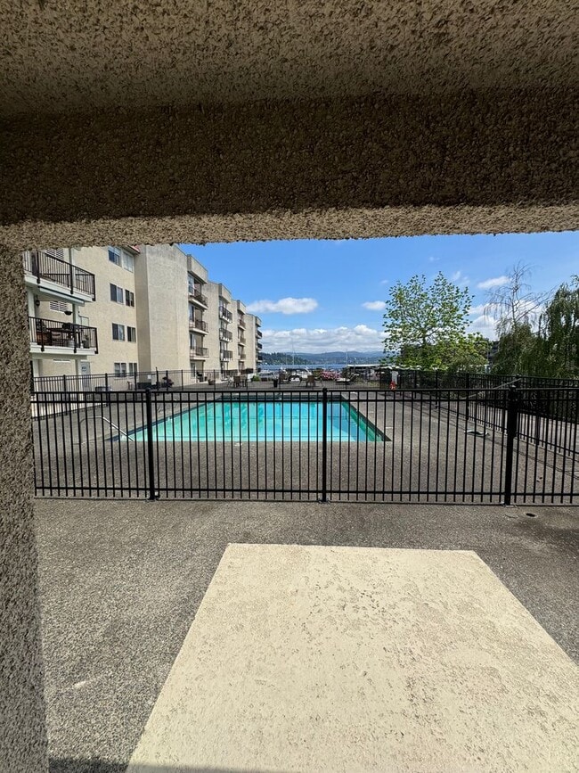 Building Photo - Gorgeous Condo in Seward Park with 2 Parking Spaces, Steps Away from Pool with Water View!