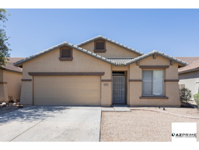 Building Photo - Experience Relaxed Phoenix Living In This Well-Appointed 4/2 Rental That Perfectly Balances Comfort,