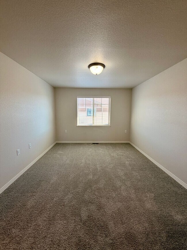 Building Photo - Move-In Ready 3-Story Townhome with Loft & 2-Car Garage