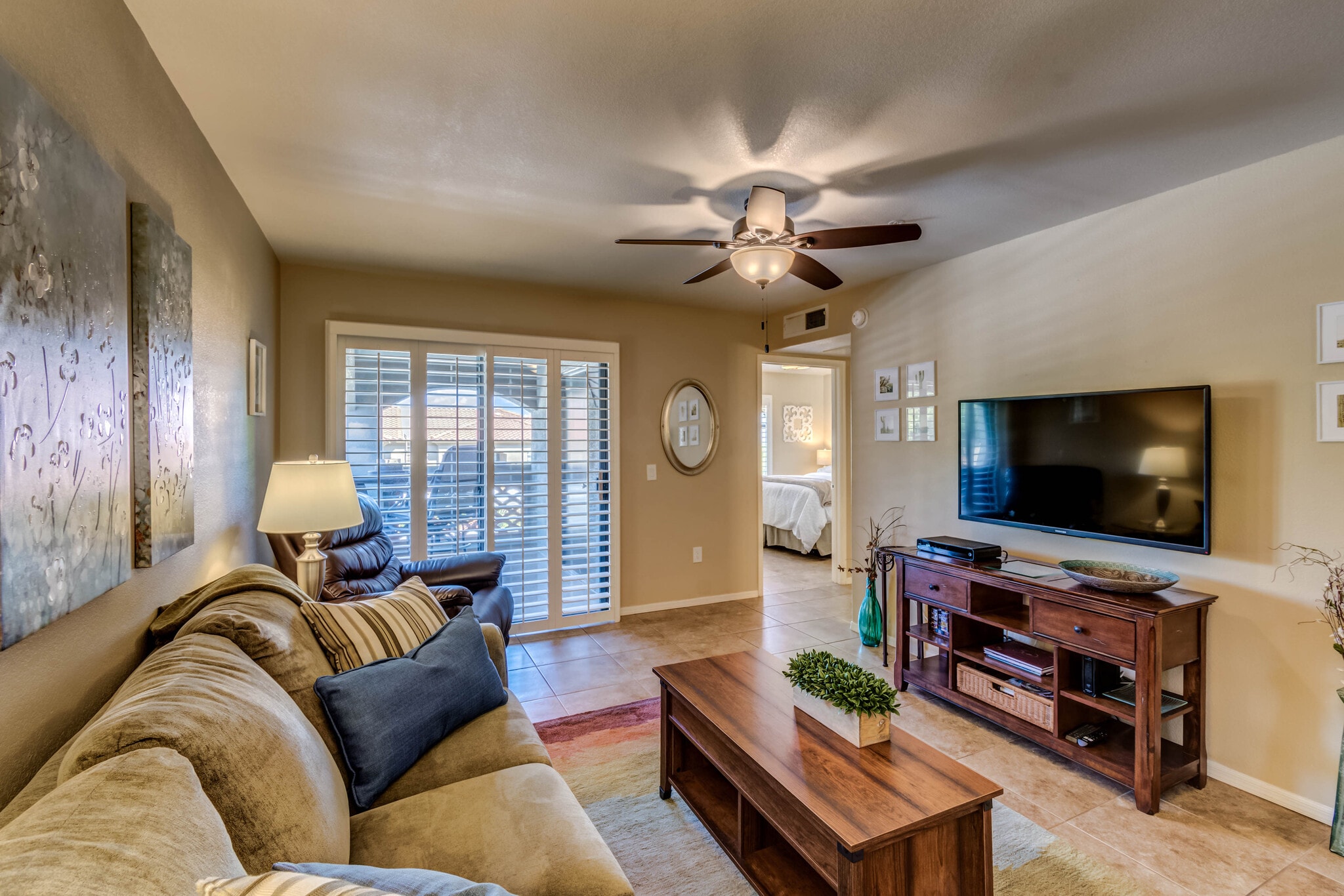 Living room into deck and bedroom - 5751 N Kolb Rd