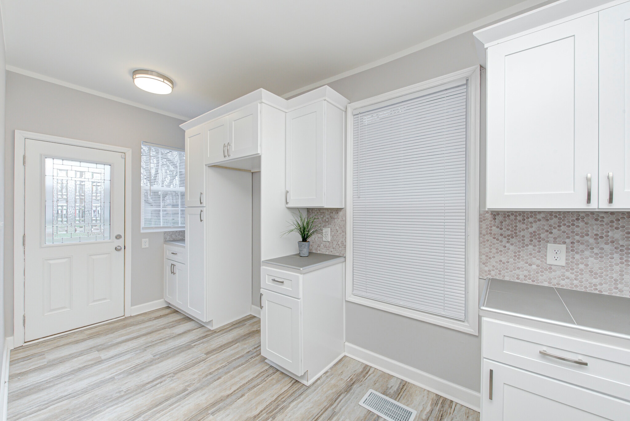 Additional kitchen cabinets and rear door - 2418 E 16th St
