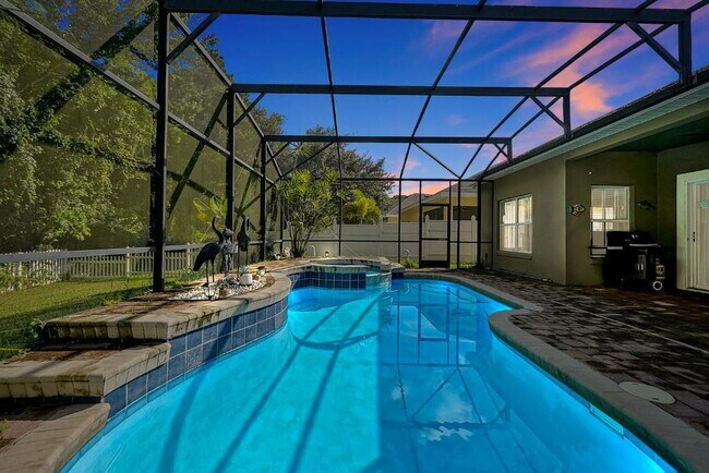 Building Photo - "Stunning 3BR Orlando Home with Private Screened Pool, Spa & Spacious Living Areas"