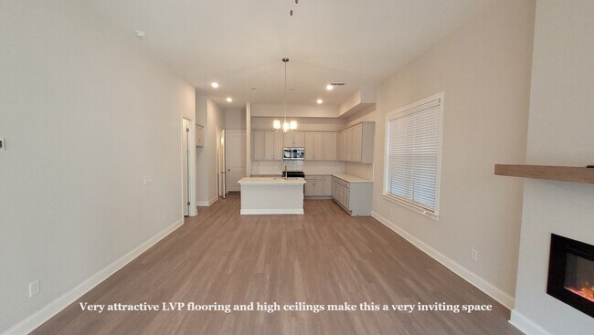 Building Photo - End-unit townhome with plenty of extra windows! Gated Community.