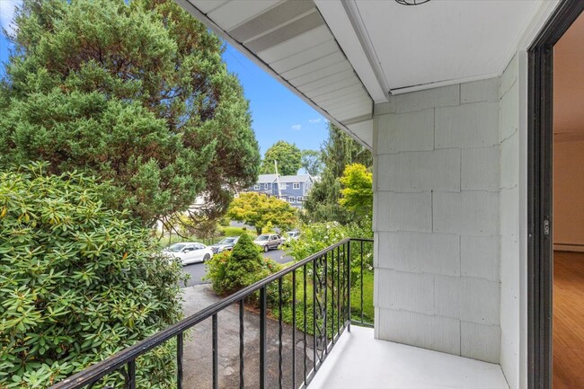 Charming balcony with a front-facing view, perfect for enjoying morning coffee or fresh air. - 45 High St